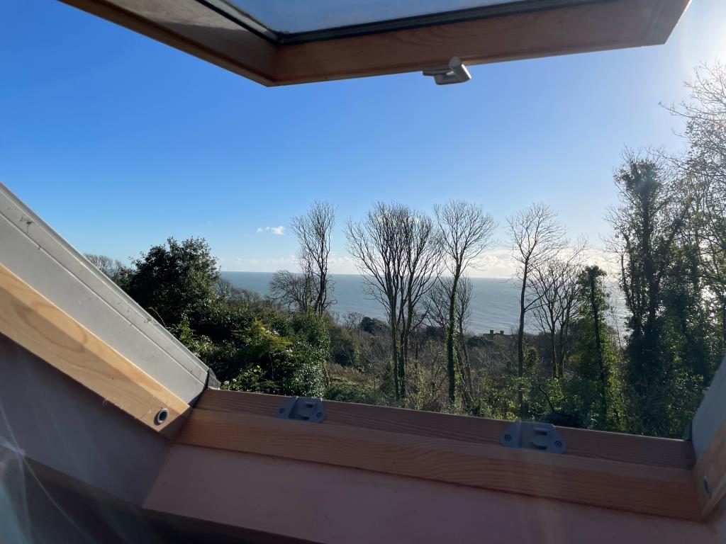 Lot: 99 - DETACHED CHALET STYLE HOME WITH SIGNIFICANT STRUCTURAL DAMAGE - View from Attic room